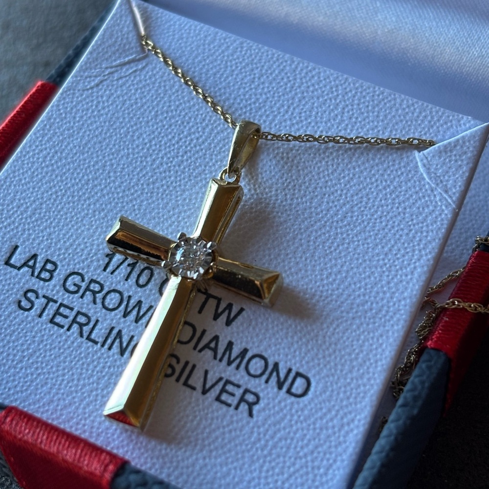 Beautiful 14 karat plated cross with man-made diamond.